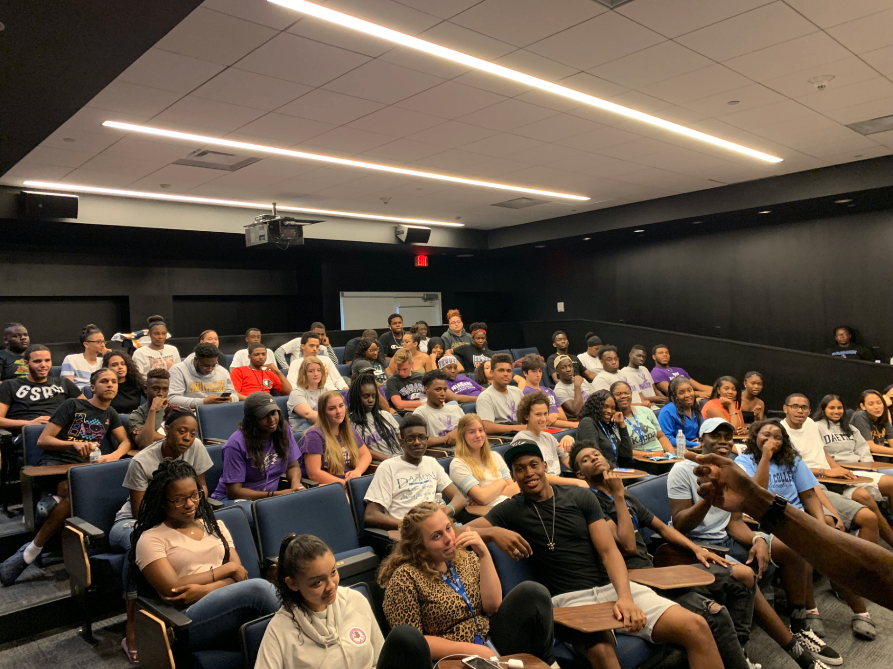 Eann Robinson presenting to a lecture hall of students